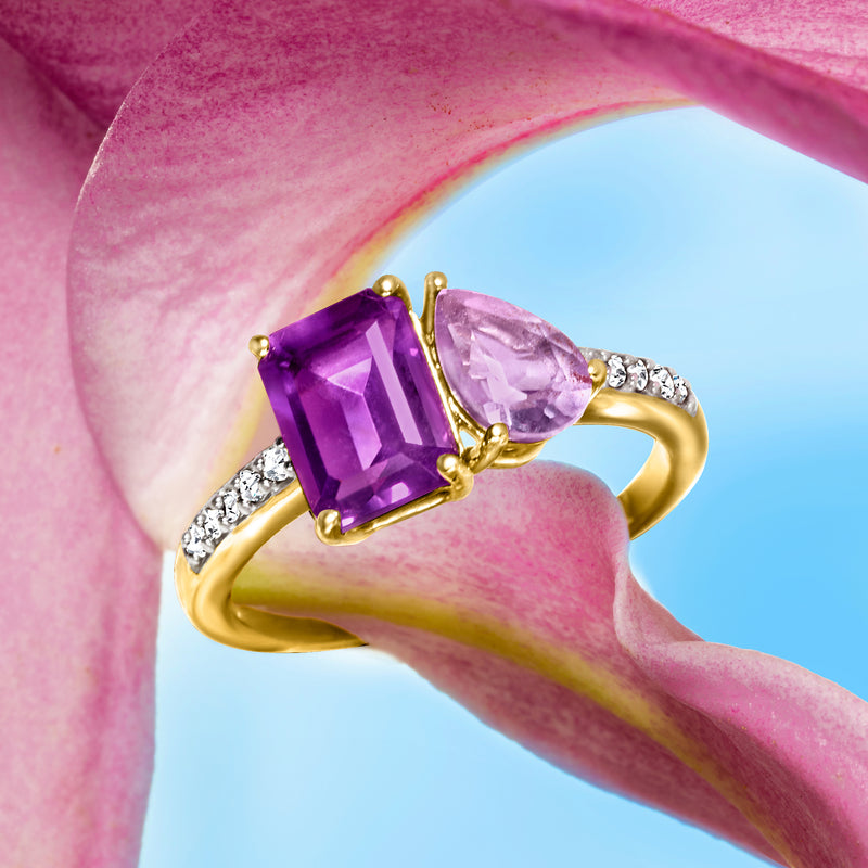 Close-up of 14kt yellow gold toi et moi ring with two amethyst stones and diamonds