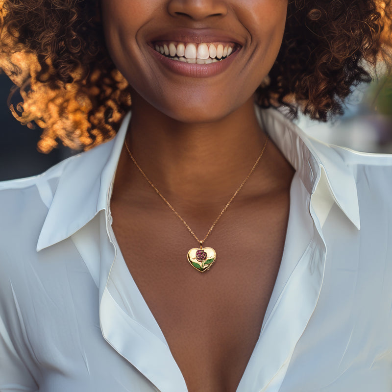 Gold heart locket necklace pendant on chain, worn on neckline
