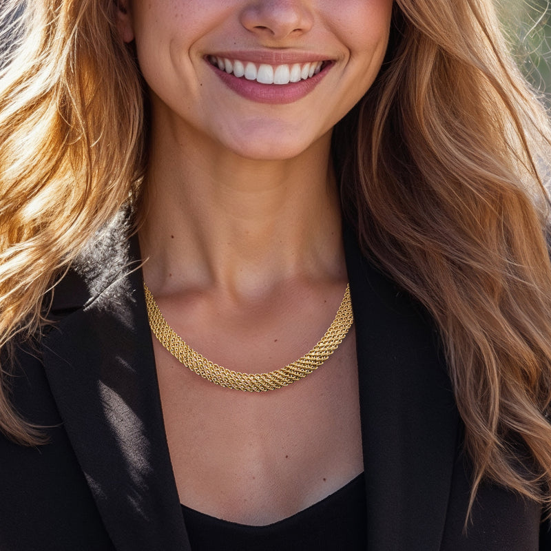 Yellow gold multi-row rope-chain necklace worn at collarbone