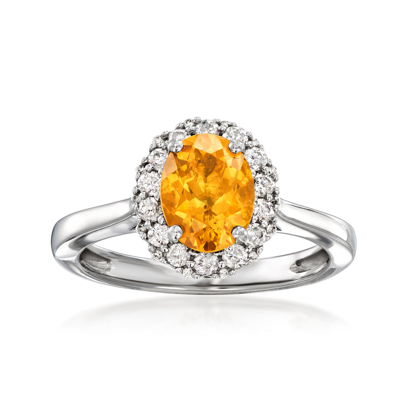 Vintage orange citrine ring in 9kt white gold with diamond halo and split shank