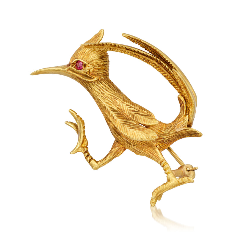 Vintage 18kt yellow gold roadrunner pin with single ruby eye