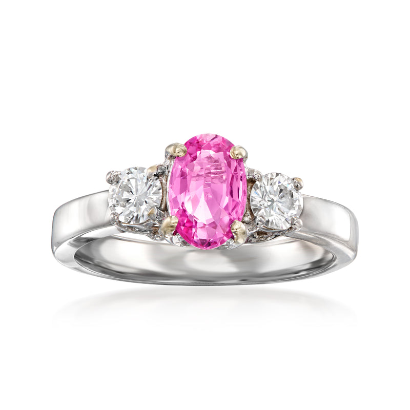 Oval pink sapphire and diamond ring in 14kt white gold with round side stones