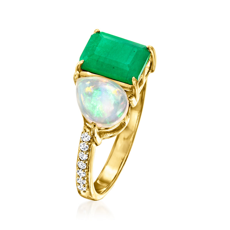 Gold ring with green emerald-cut stone, round opal-like cabochon, and diamond accents