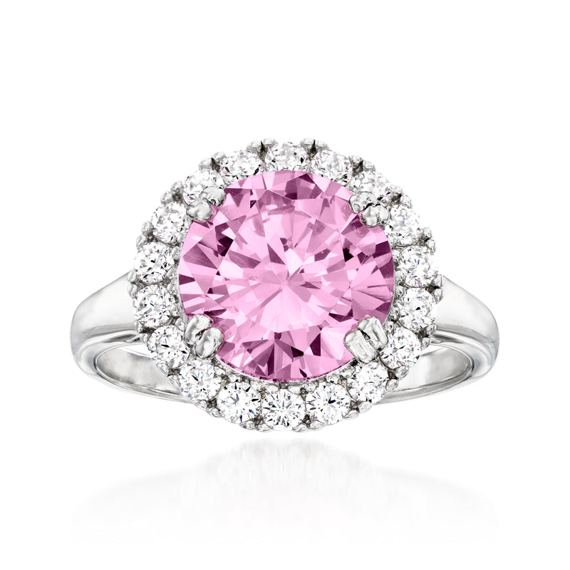 Sterling silver ring with large round pink stone and halo of clear stones