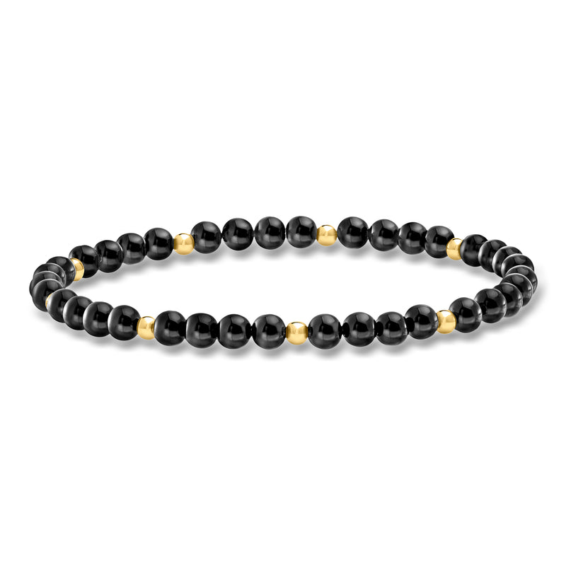 Onyx bead stretch bracelet with 14kt yellow gold accents in dark round beads
