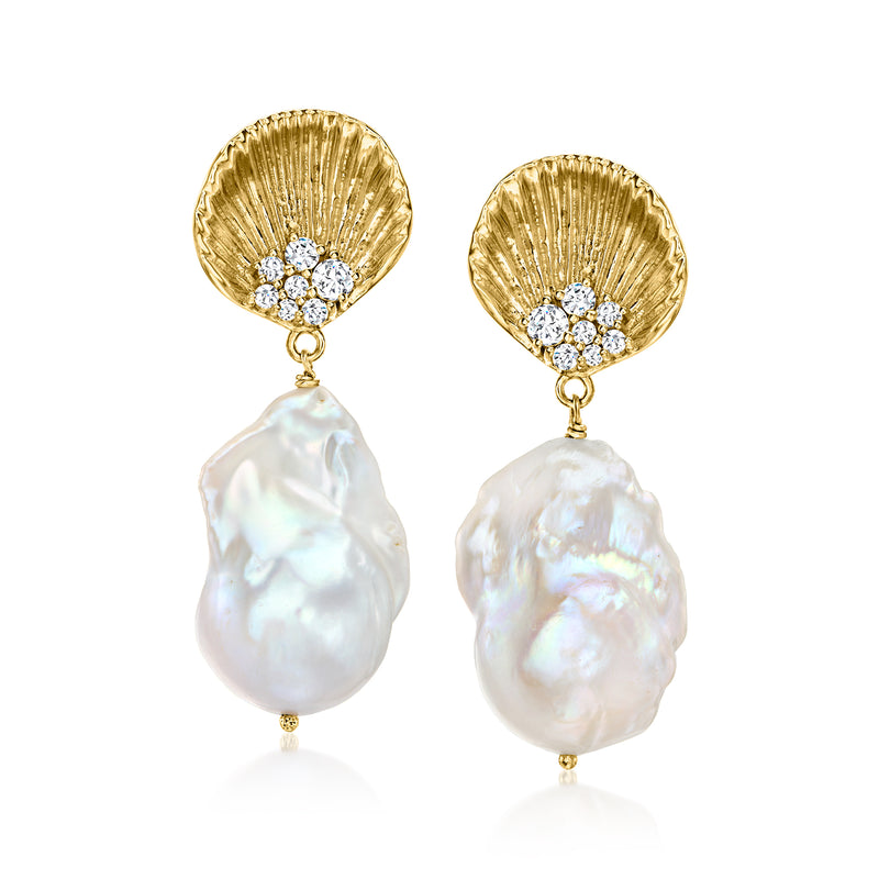 Gold-tone drop earrings with white shell pearls and a small crystal cluster top