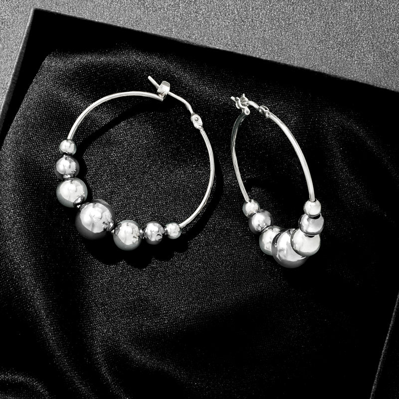 Sterling silver bead hoop earrings, two hoops shown with ball beads detail