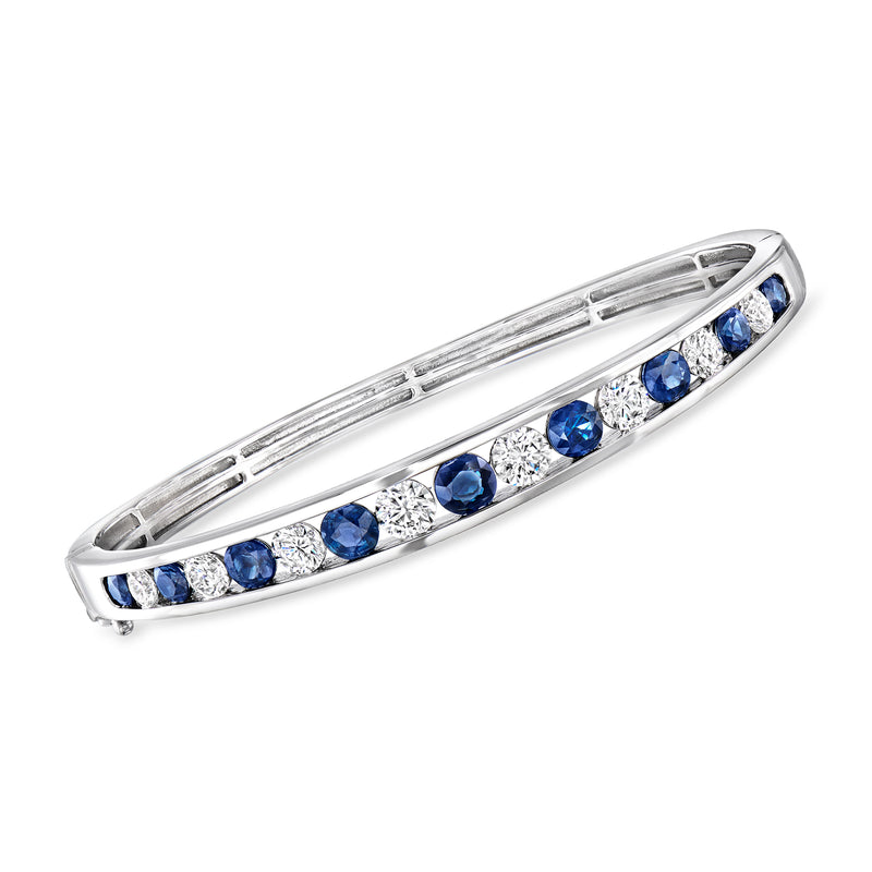 14kt white gold bangle bracelet with blue sapphire and white diamond row.