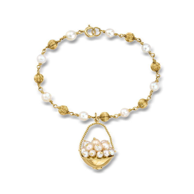 14kt yellow gold pearl bead station bracelet with dangling basket charm