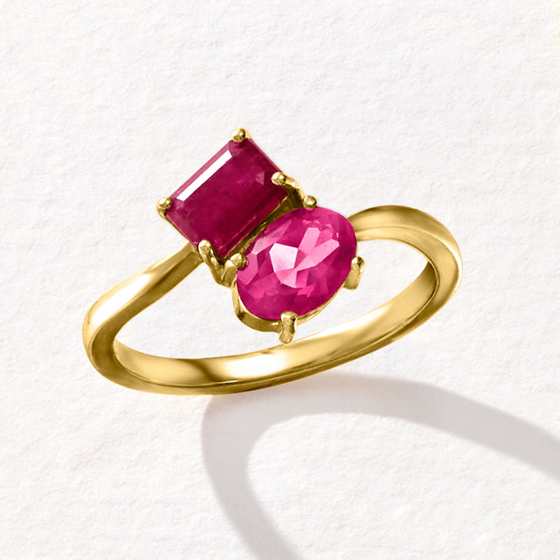 14kt yellow gold ring with emerald-cut ruby and oval pink topaz, angled view