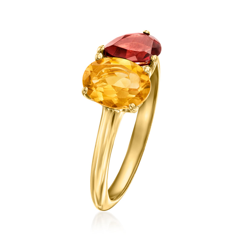 Gold toi et moi ring angled view with oval citrine and oval garnet stones on band
