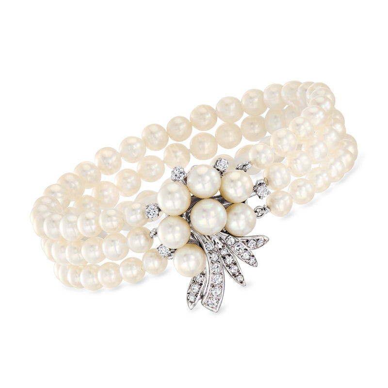 Cultured pearl bracelet with diamond accents and leaf-shaped floral clasp, white gold.