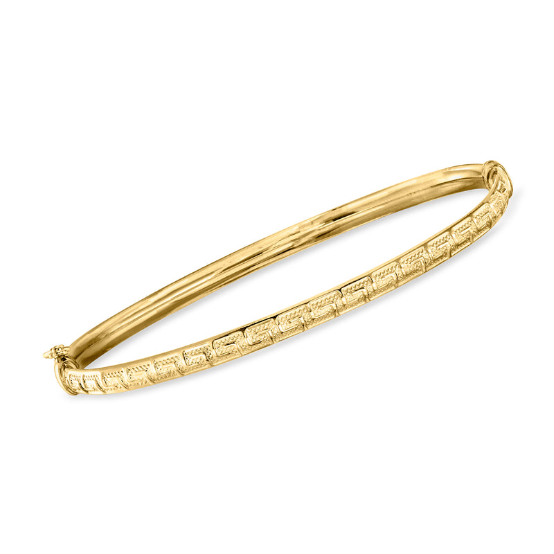 14kt yellow gold oval bangle bracelet with engraved Greek key pattern, hinged clasp.