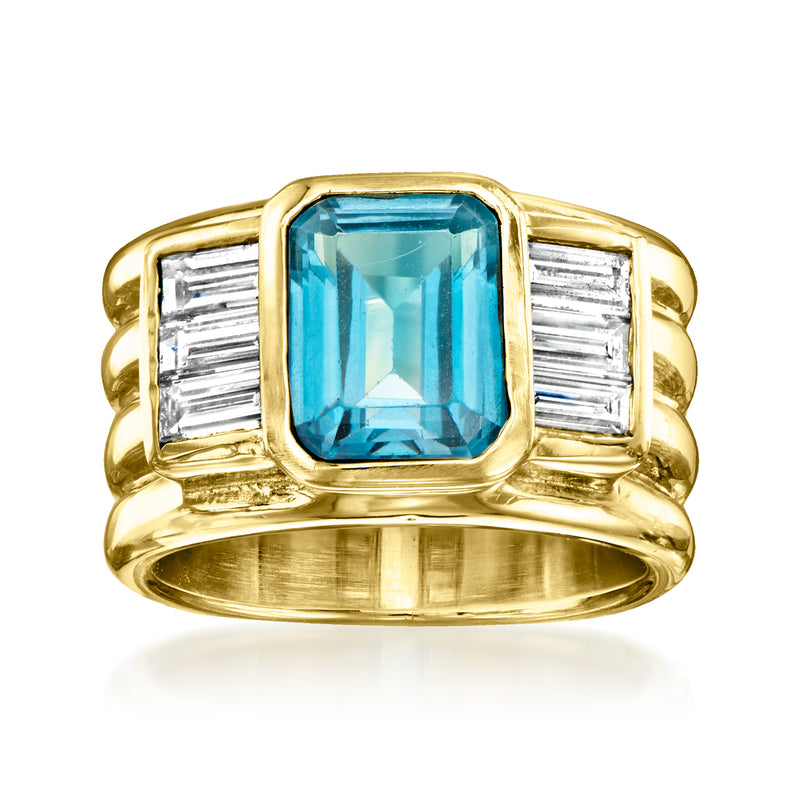 Vintage yellow gold ring with emerald-cut blue topaz center and baguette diamond sides
