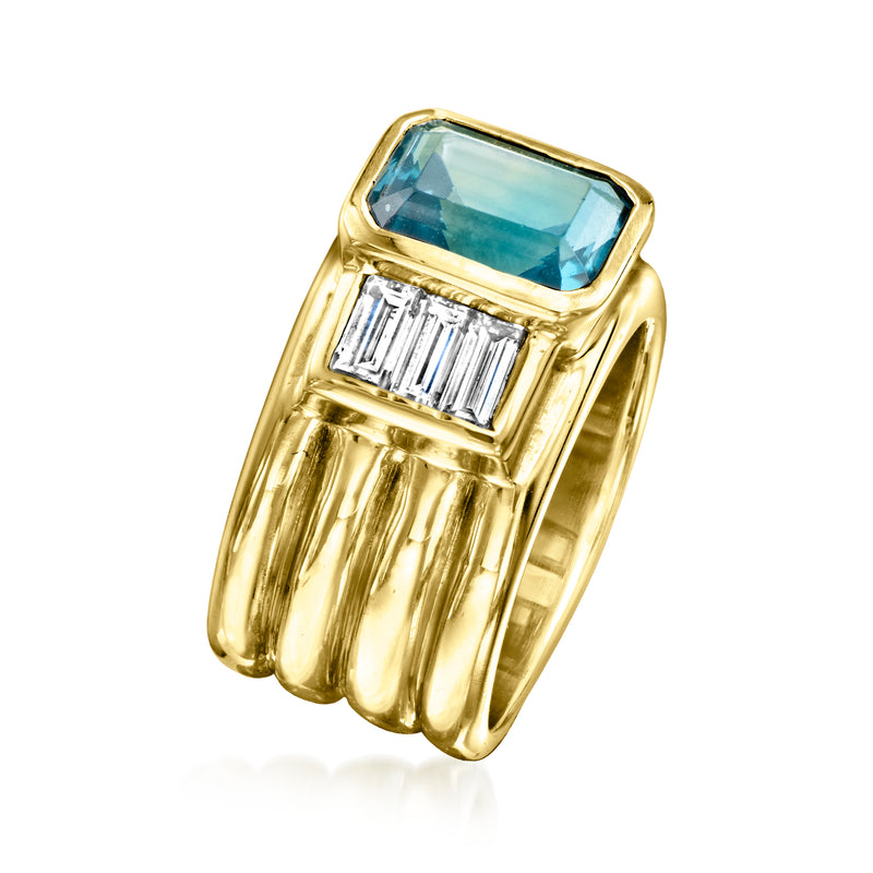 Yellow gold ring featuring emerald-cut blue topaz with baguette diamond shoulders