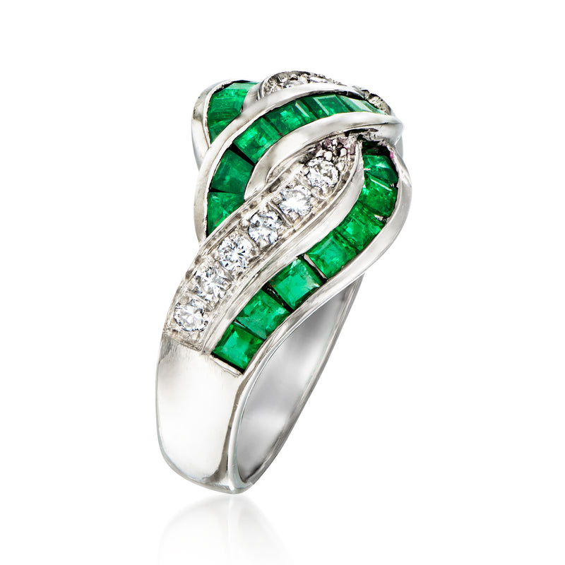 Platinum twist ring with emerald and diamond rows