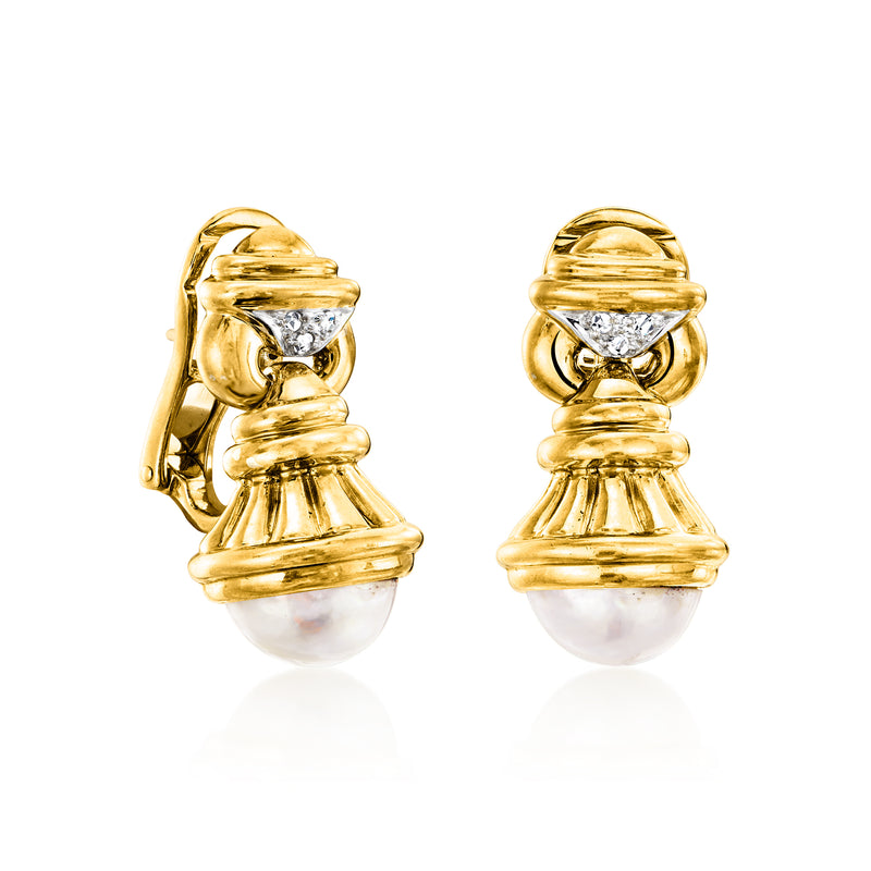 Yellow gold drop earrings with white mabe pearl and diamond accents, side view