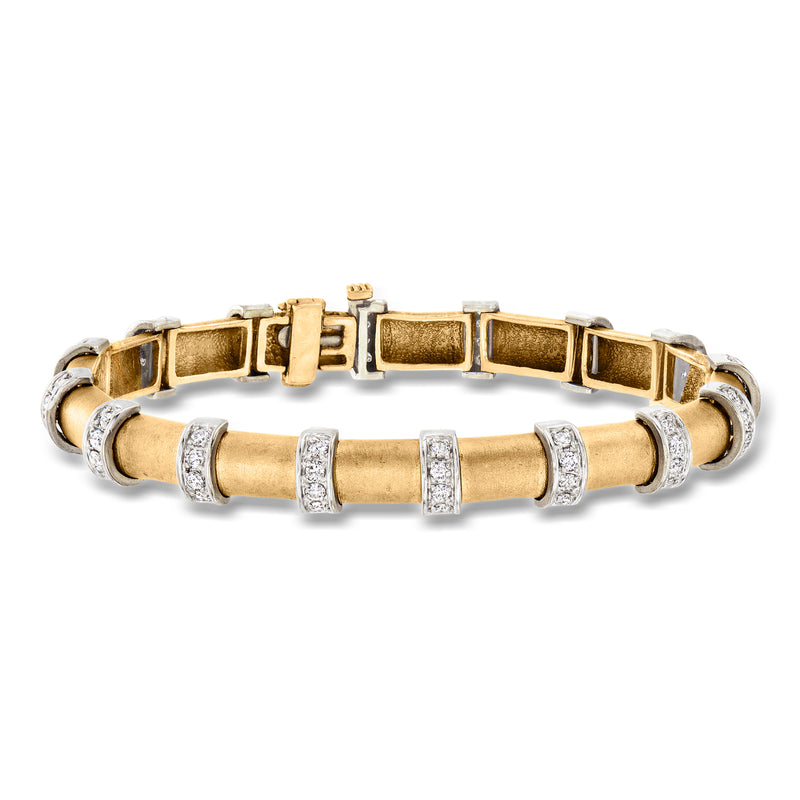 Two-tone gold diamond bracelet with rectangular links and small bezel-set stones