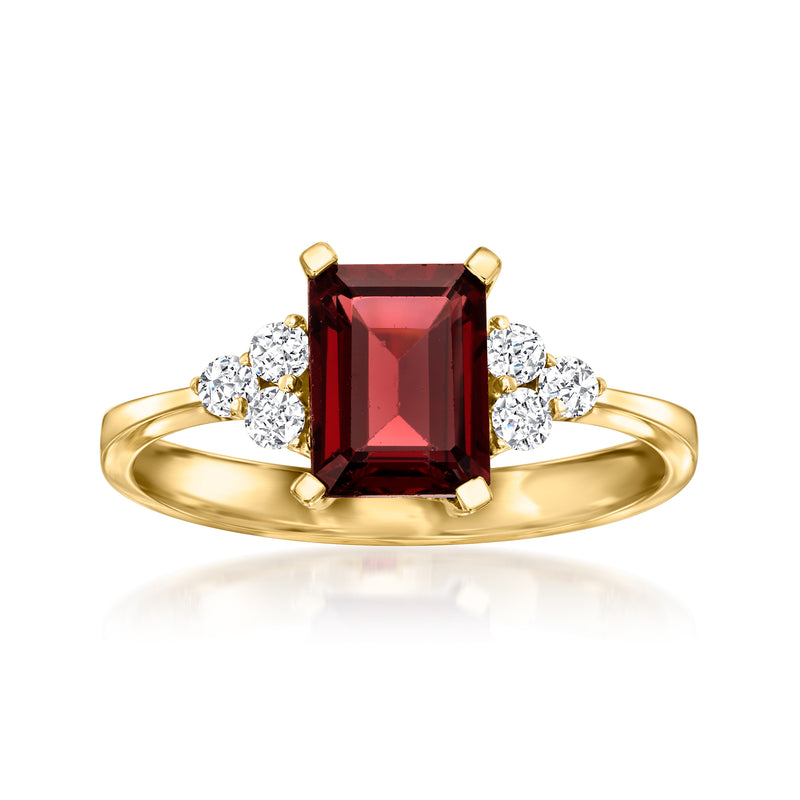 14kt yellow gold ring with red emerald-cut garnet and diamond side stones