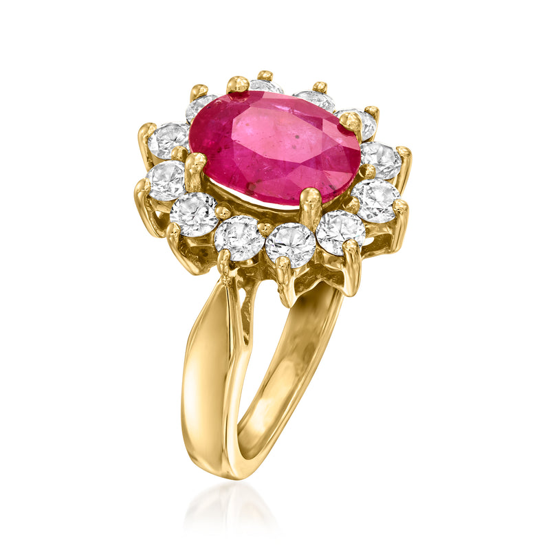 14k yellow gold ring, angled view: oval pink ruby with diamond petal details