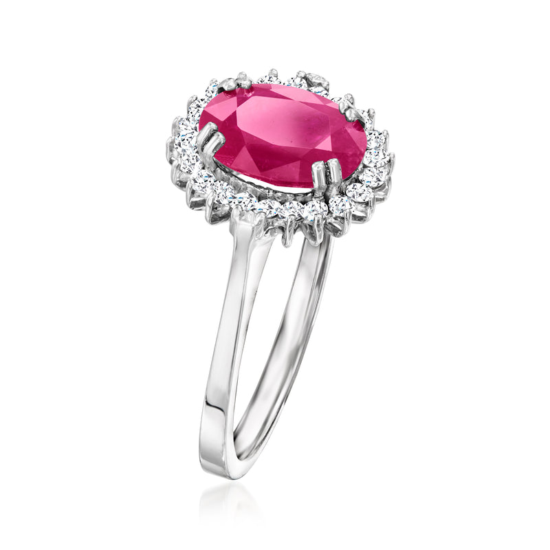 14kt white gold ring with oval pink ruby center, diamond halo and prongs