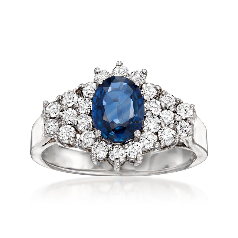 Oval blue sapphire halo diamond ring, prong-set in white gold