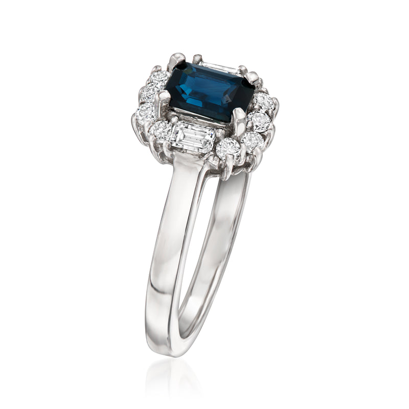 White gold ring with dark blue square sapphire center and diamond cluster halo