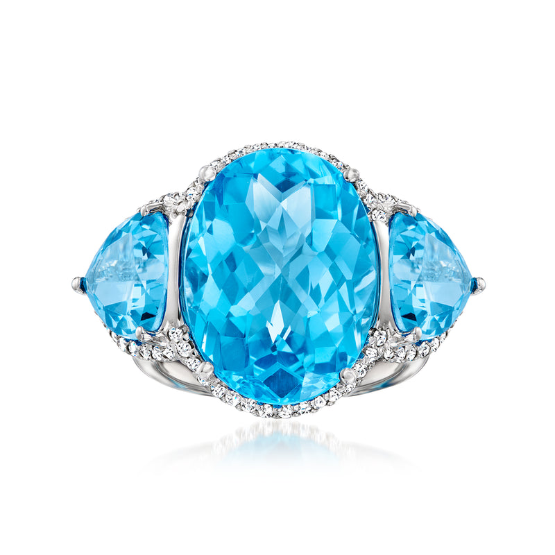 Swiss blue topaz and diamond ring in white gold with oval center stone and side halos