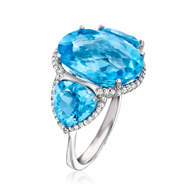 White gold ring with large oval blue topaz, two blue topaz accents, and diamond band