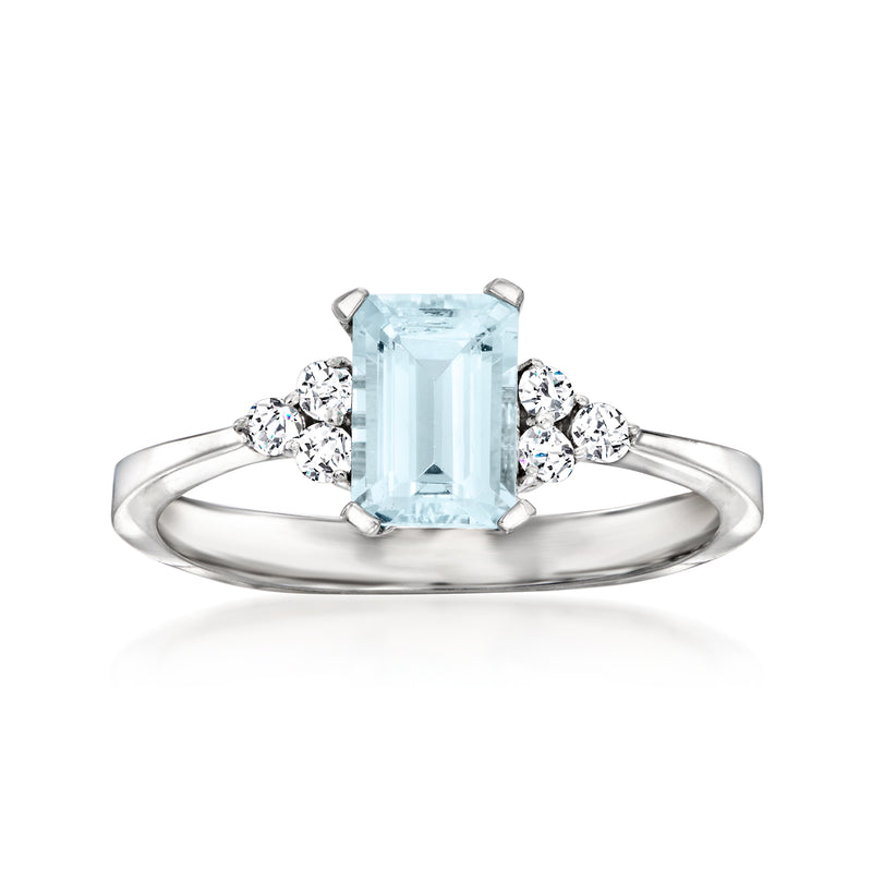 14kt white gold ring with rectangular aquamarine center and round diamond accents