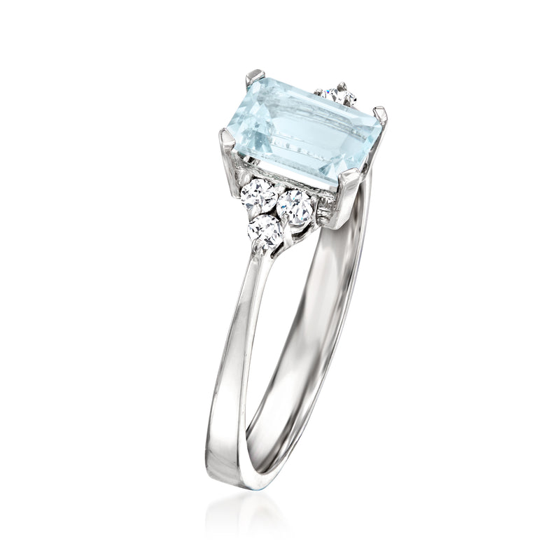 Aquamarine gemstone ring in 14kt white gold with side round diamond clusters