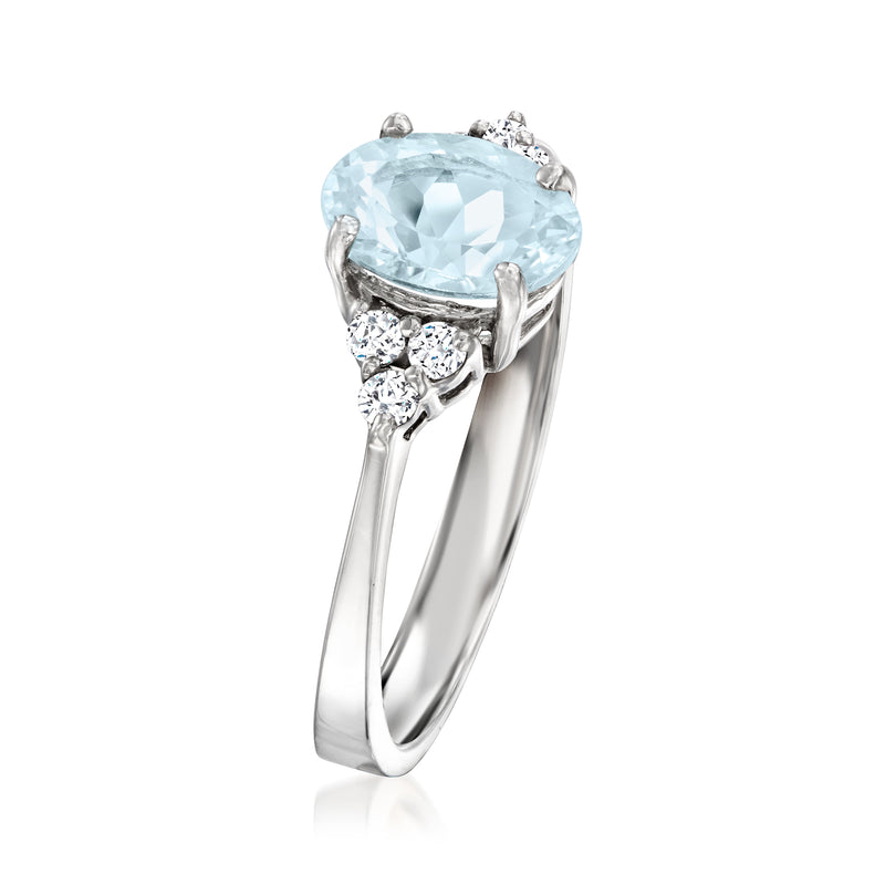14kt white gold ring with oval aquamarine and prong-set diamonds on the shoulders