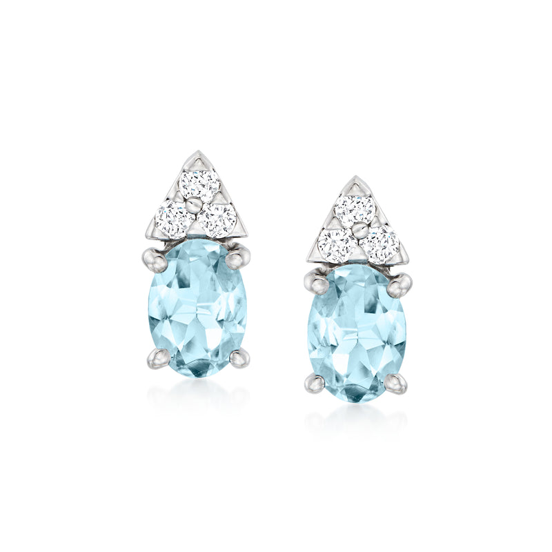 Aquamarine and diamond stud earrings, oval light-blue stones with diamond clusters