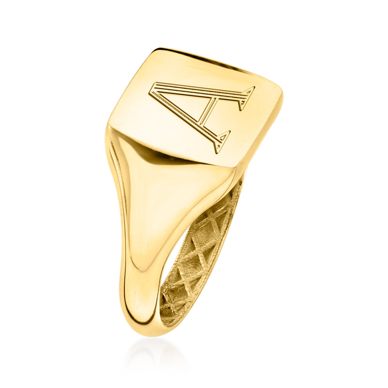 Yellow gold signet ring with engraved letter A, angled side view