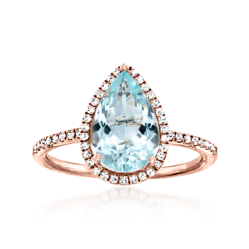 Rose gold halo ring with pear-cut aquamarine and diamond accents