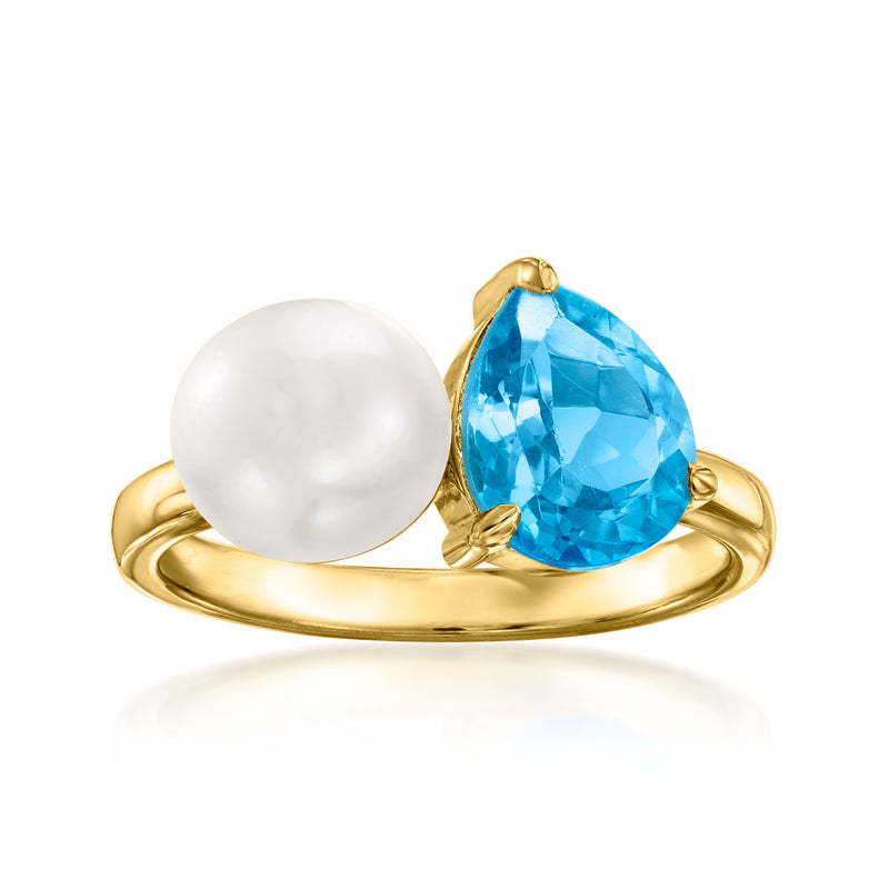 Gold ring with cultured pearl and oval blue topaz, toi et moi setting