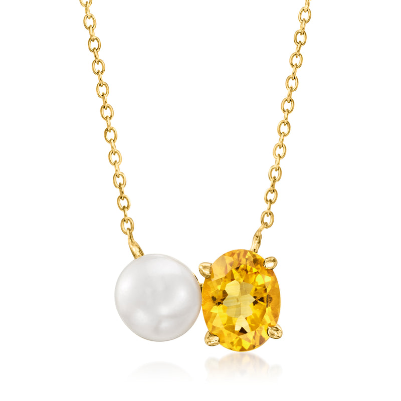 Gold pendant necklace with round cultured pearl and oval yellow citrine, linked by chain