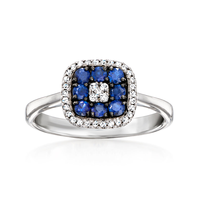 14kt white gold ring with blue sapphire cluster and diamond halo around center