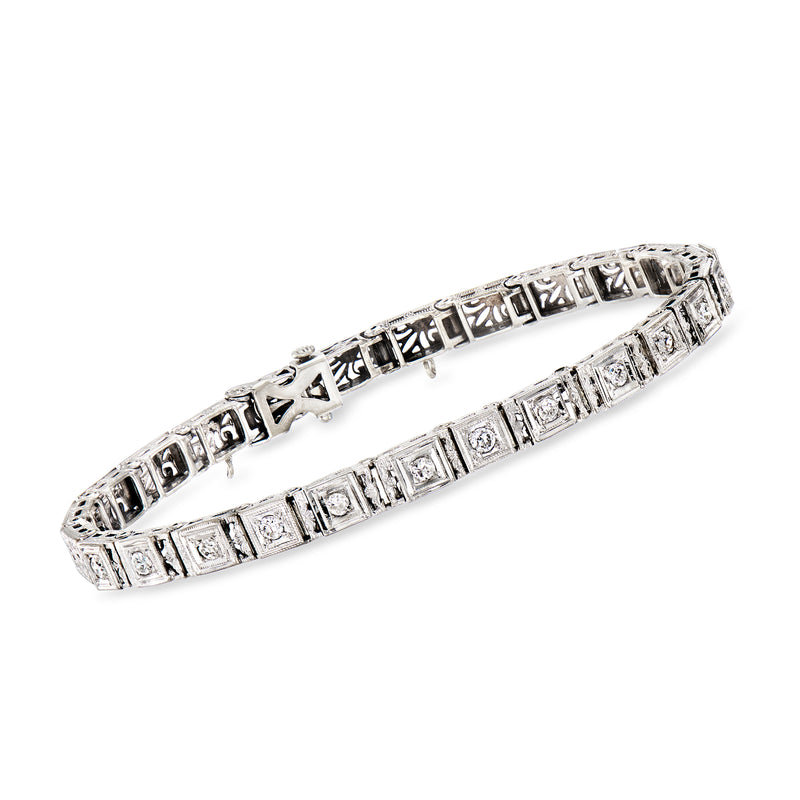 Vintage 14kt white gold diamond bracelet with rectangular step-set settings.