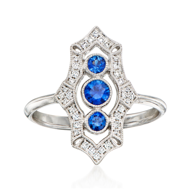 Vintage 14kt white gold ring with three round blue sapphires and diamond accents