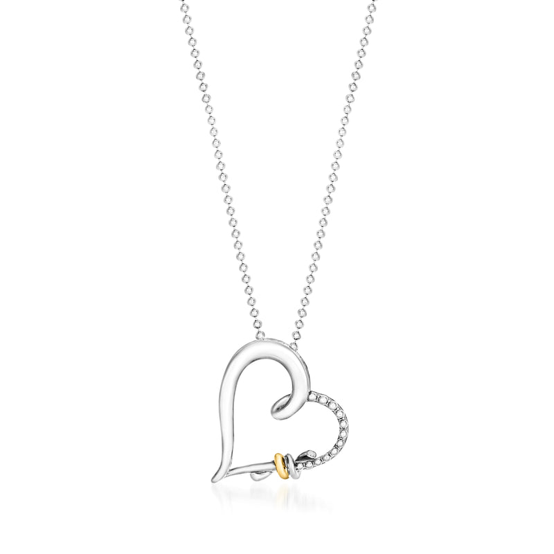 Sterling silver heart pendant necklace with 18kt yellow gold accent and small stone detail
