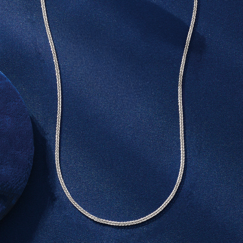 Platinum wheat-chain necklace draped in a U-shape, fine interlocking links