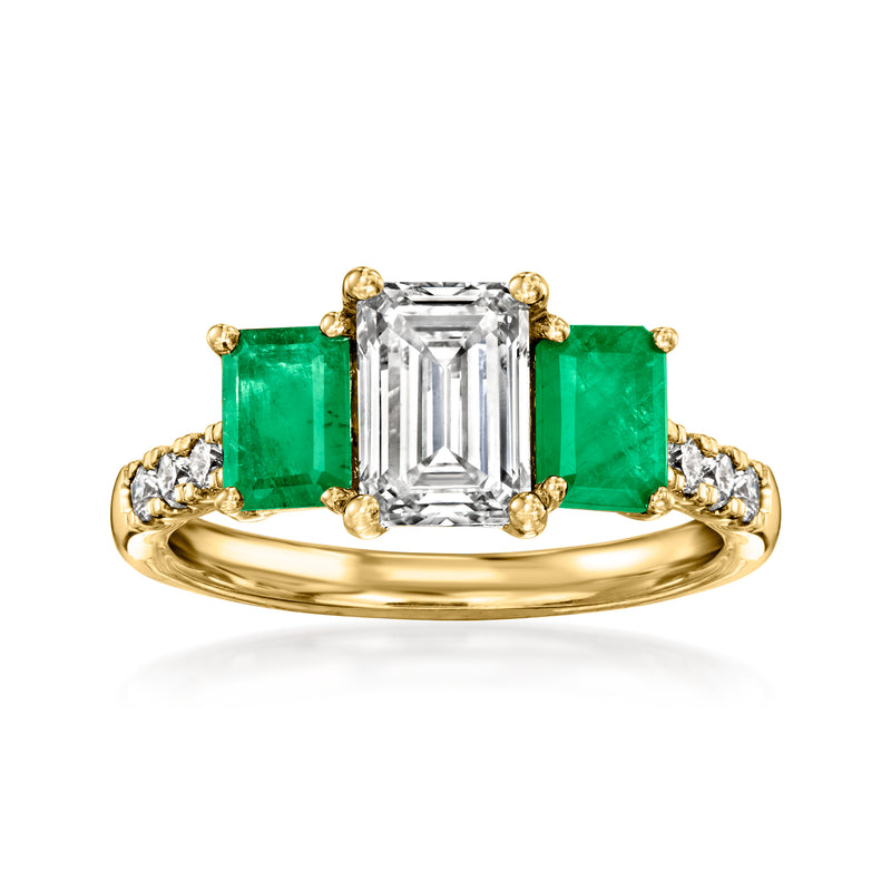 14kt yellow gold ring with central emerald-cut diamond and green emerald side stones