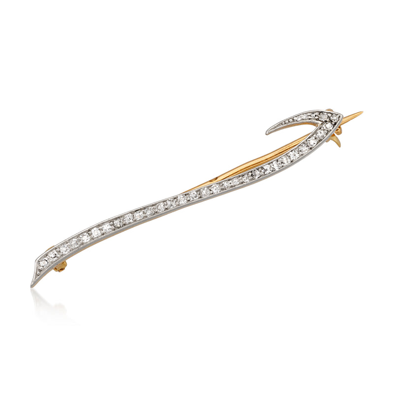 Vintage diamond bar pin with white metal setting and yellow gold end tips