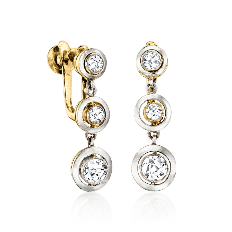 Vintage diamond drop clip earrings with three round diamonds, gold back and white settings