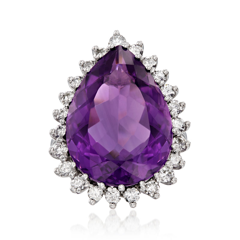 Amethyst gemstone ring with pear-shaped purple stone and round diamond halo in white gold