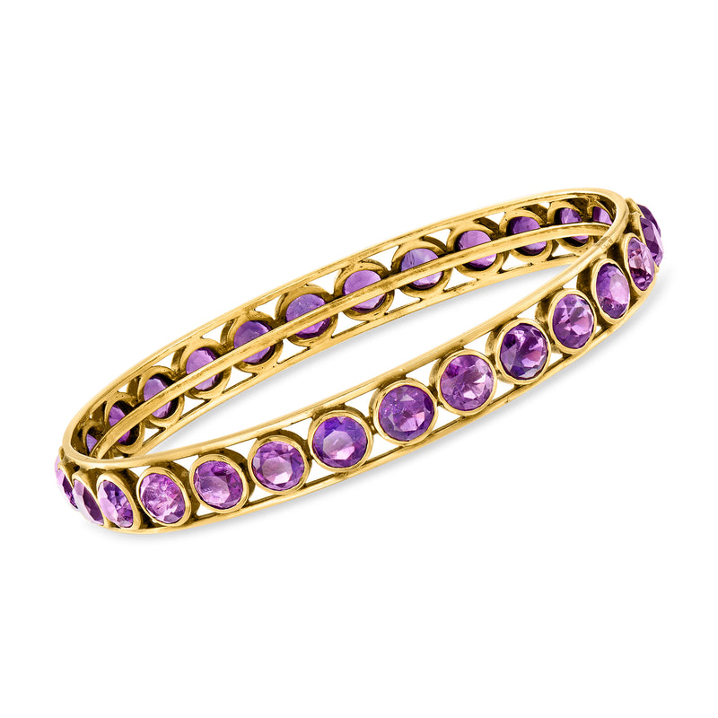18kt yellow gold bangle bracelet with oval amethyst gemstones in a line setting