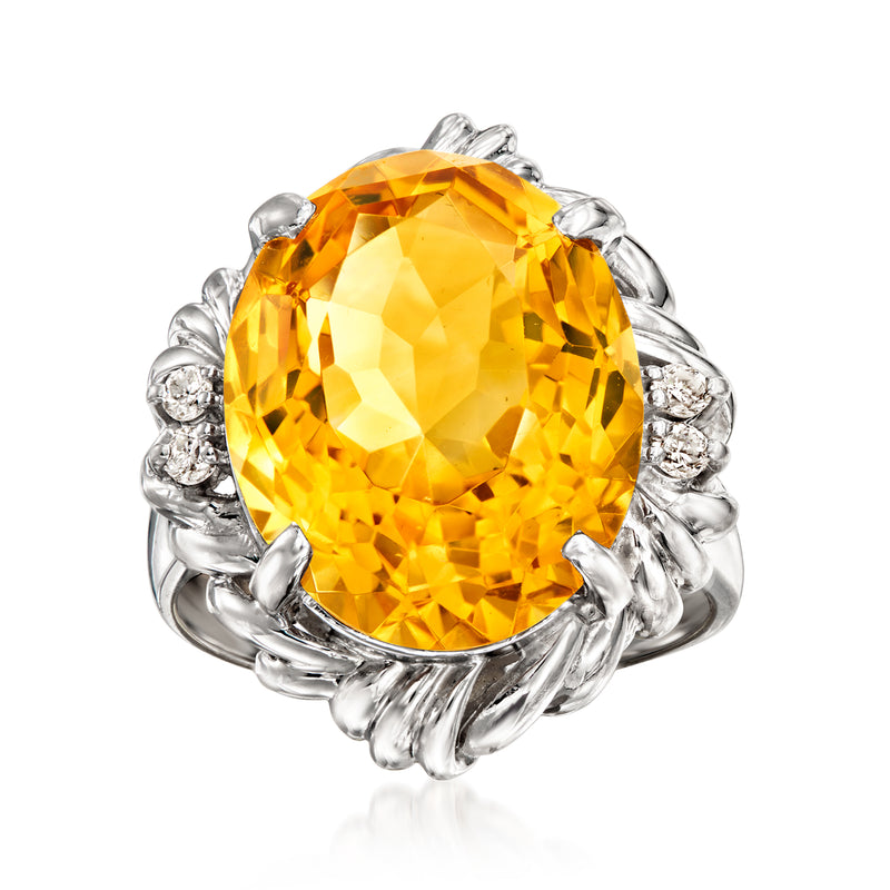 Vintage platinum ring with oval citrine gemstone and round diamond side stones