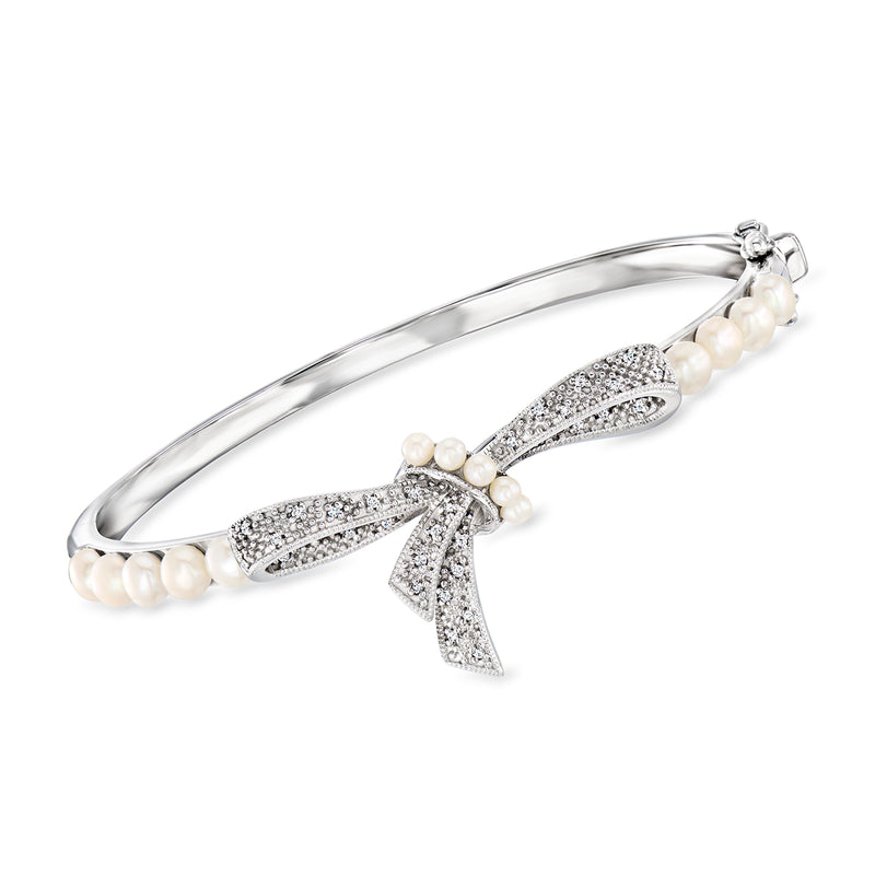Sterling silver bow bangle bracelet with cultured pearl rows and pave diamond-style accents