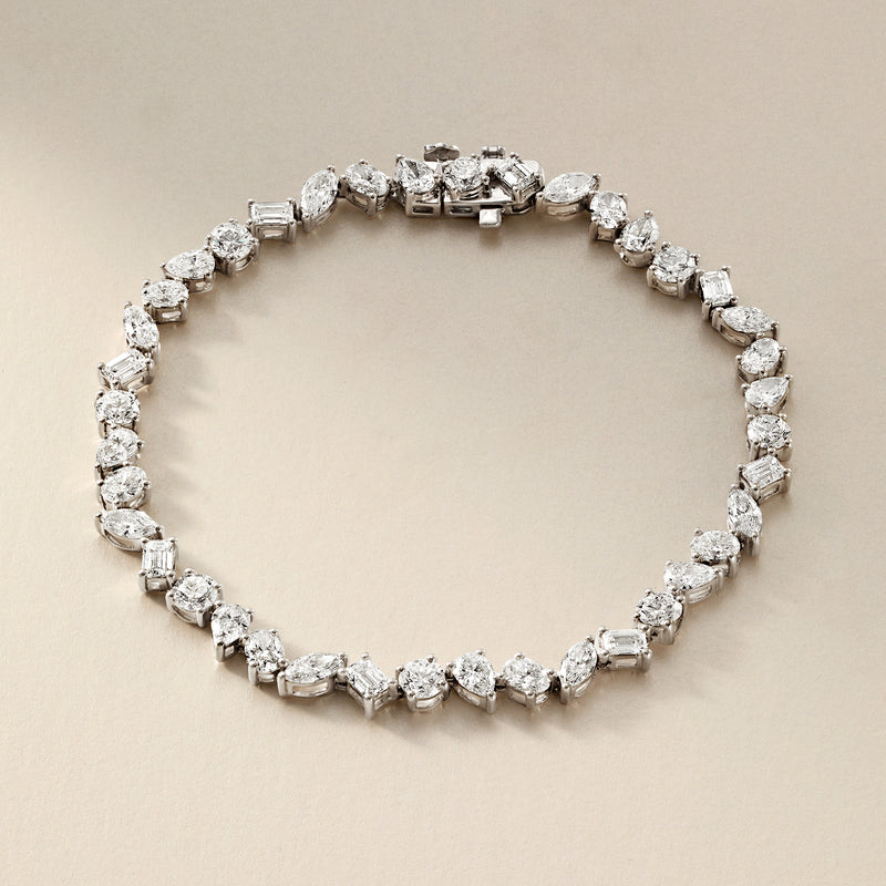 14kt white gold tennis bracelet with multi-shaped diamonds, close-up front